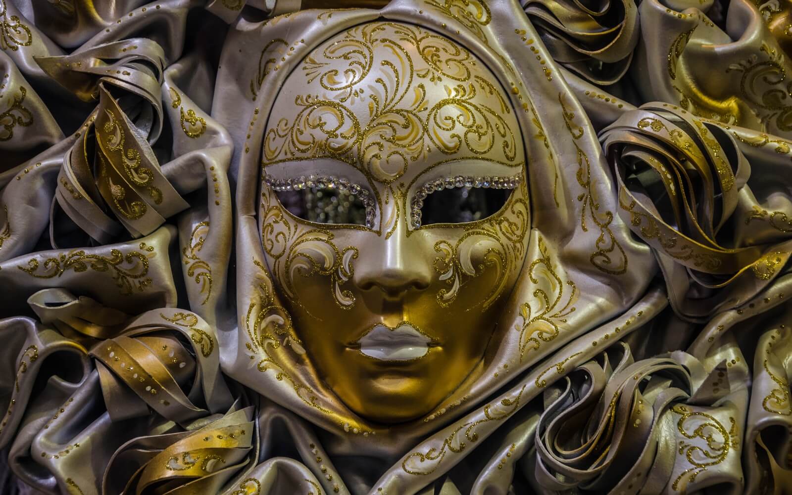 gold and white masquerade ball mask